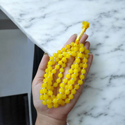 Natural Yellow Hakik Mala 8MM beads with spiritual threadwork and lab certificate, displayed in two variants