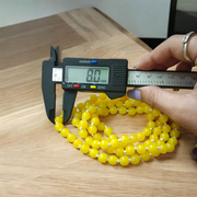 Natural Yellow Hakik Mala 8MM beads with spiritual threadwork and lab certificate, displayed in two variants