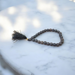 Natural black lava stone mala with 108+1 beads, handcrafted for meditation and healing – Malawala