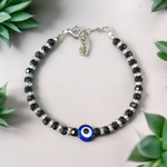 Nazariya anklet for kids with black beads and silver-toned accents, designed for spiritual protection, luck, and daily comfort