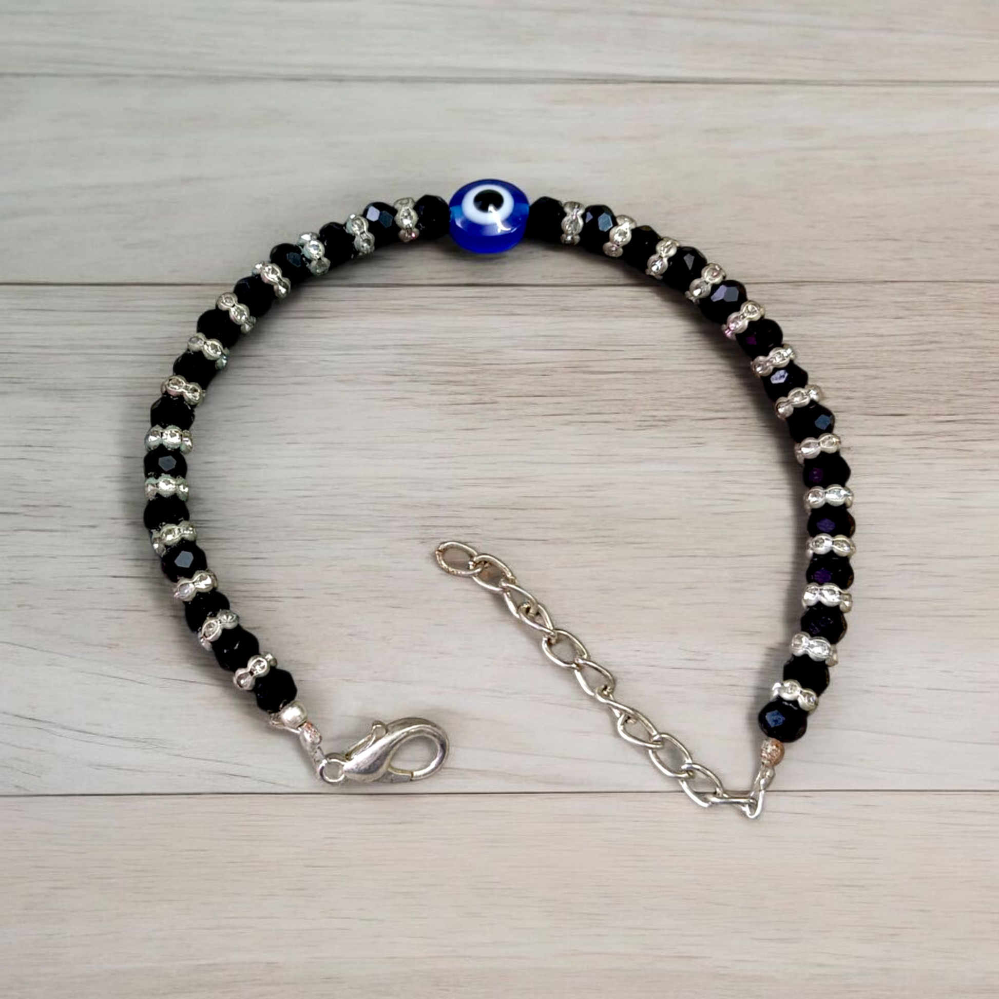 Nazariya anklet for kids with black beads and silver-toned accents, designed for spiritual protection, luck, and daily comfort
