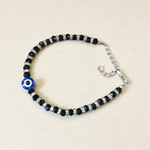 Nazariya anklet for kids with black beads and silver-toned accents, designed for spiritual protection, luck, and daily comfort