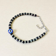 Nazariya anklet for kids with black beads and silver-toned accents, designed for spiritual protection, luck, and daily comfort
