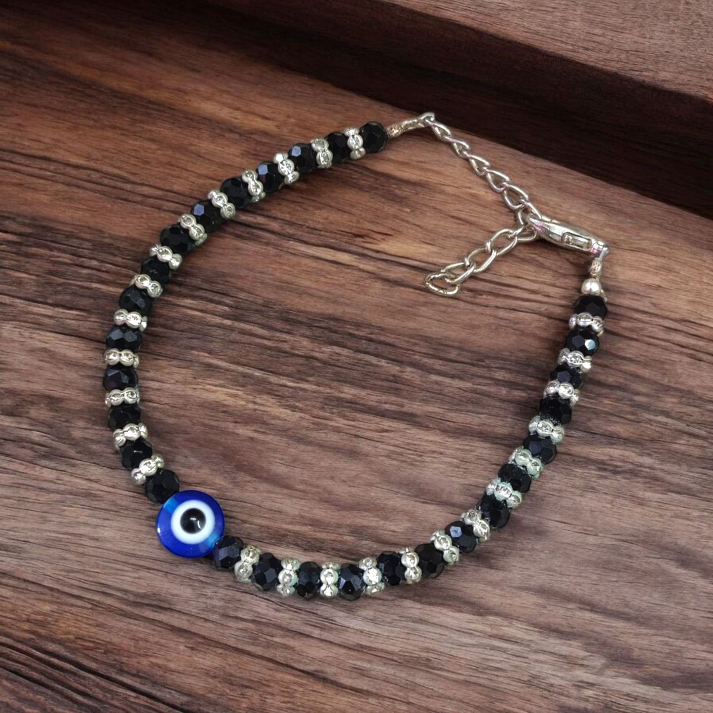 Nazariya anklet for kids with black beads and silver-toned accents, designed for spiritual protection, luck, and daily comfort