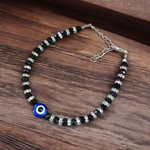 Nazariya anklet for kids with black beads and silver-toned accents, designed for spiritual protection, luck, and daily comfort