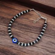 Nazariya anklet for kids with black beads and silver-toned accents, designed for spiritual protection, luck, and daily comfort