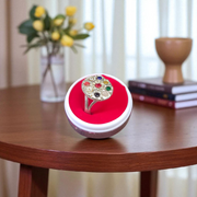 Oval-shaped gold-plated Navratan ring with nine colorful gemstones set in a tortoise design for spiritual and astrological benefits