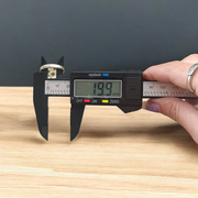 Oval-shaped gold-plated Navratan ring with nine colorful gemstones set in a tortoise design for spiritual and astrological benefits