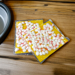 Pack of 200 saffron-colored cotton wicks (Kesar Jyot Batti), neatly packed and ready for diya lighting during spiritual rituals