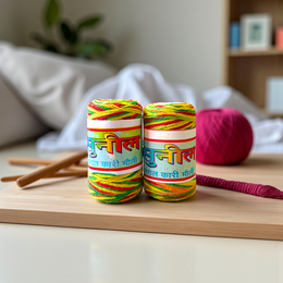 Pack of 2 multi-colored cotton moli threads with red, yellow, and green twists, neatly coiled for pooja use