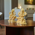 Pair of brass idols featuring Goddess Lakshmi and Lord Ganesha in intricate design, ideal for puja, gifting, and home decor
