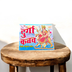 Pocket-sized Durga Kavach book in Hindi with red and gold cover, includes Chalisa, Aarti, and Poojan Vidhi – Ideal for daily worship and travel