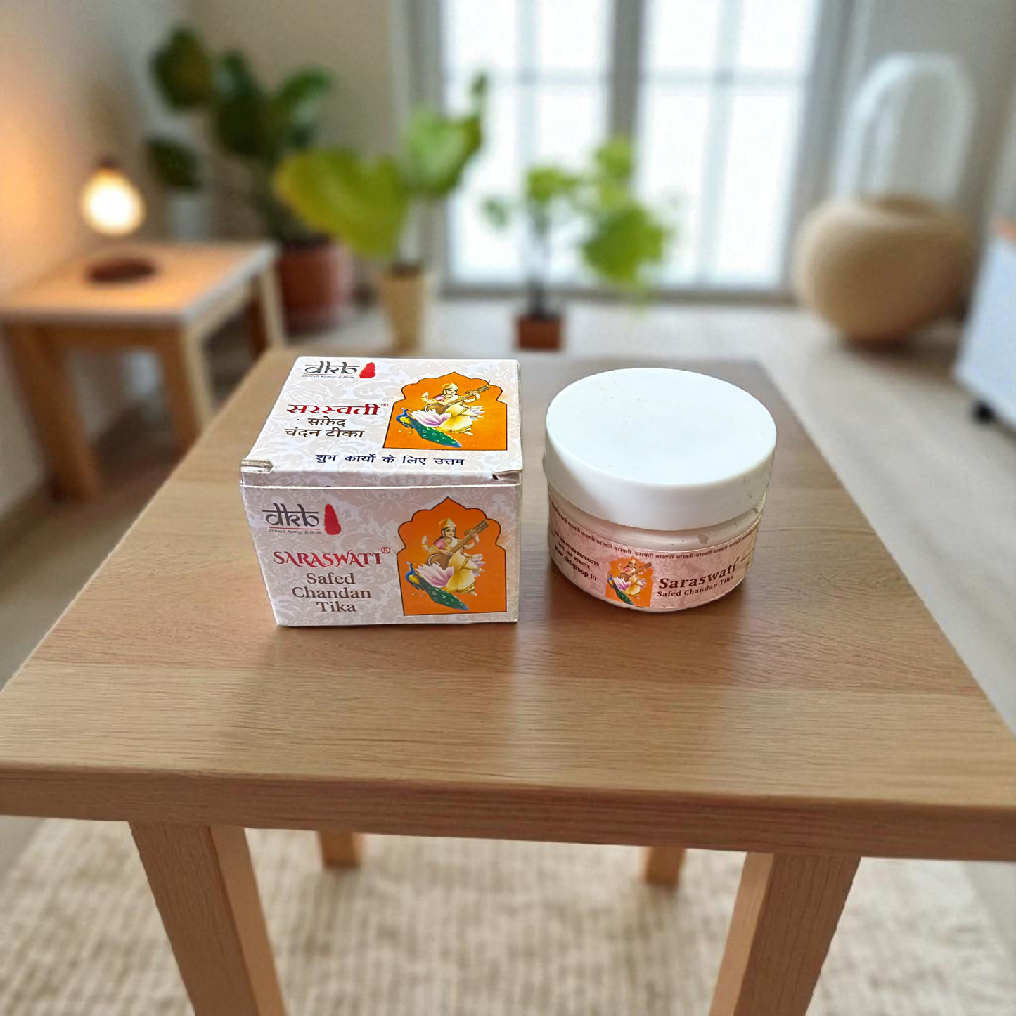 Pure white sandalwood paste (Safed Chandan Tilak) in a small container with creamy texture, ready for spiritual application