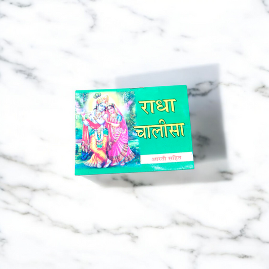 Radha Chalisa Hindi Book with devotional artwork of Radharani, placed beside incense and flowers in a prayer setting