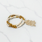 Radha Krishna Tulsi Chandan Mala featuring alternating Tulsi and sandalwood beads, engraved pendant, and screw-lock clasp, displayed neatly