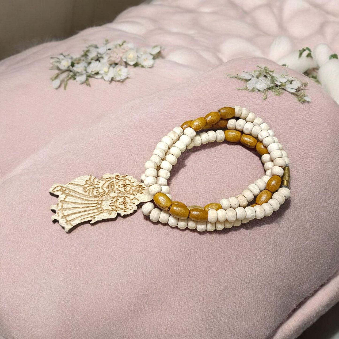 Radha Krishna Tulsi Chandan Mala featuring alternating Tulsi and sandalwood beads, engraved pendant, and screw-lock clasp, displayed neatly