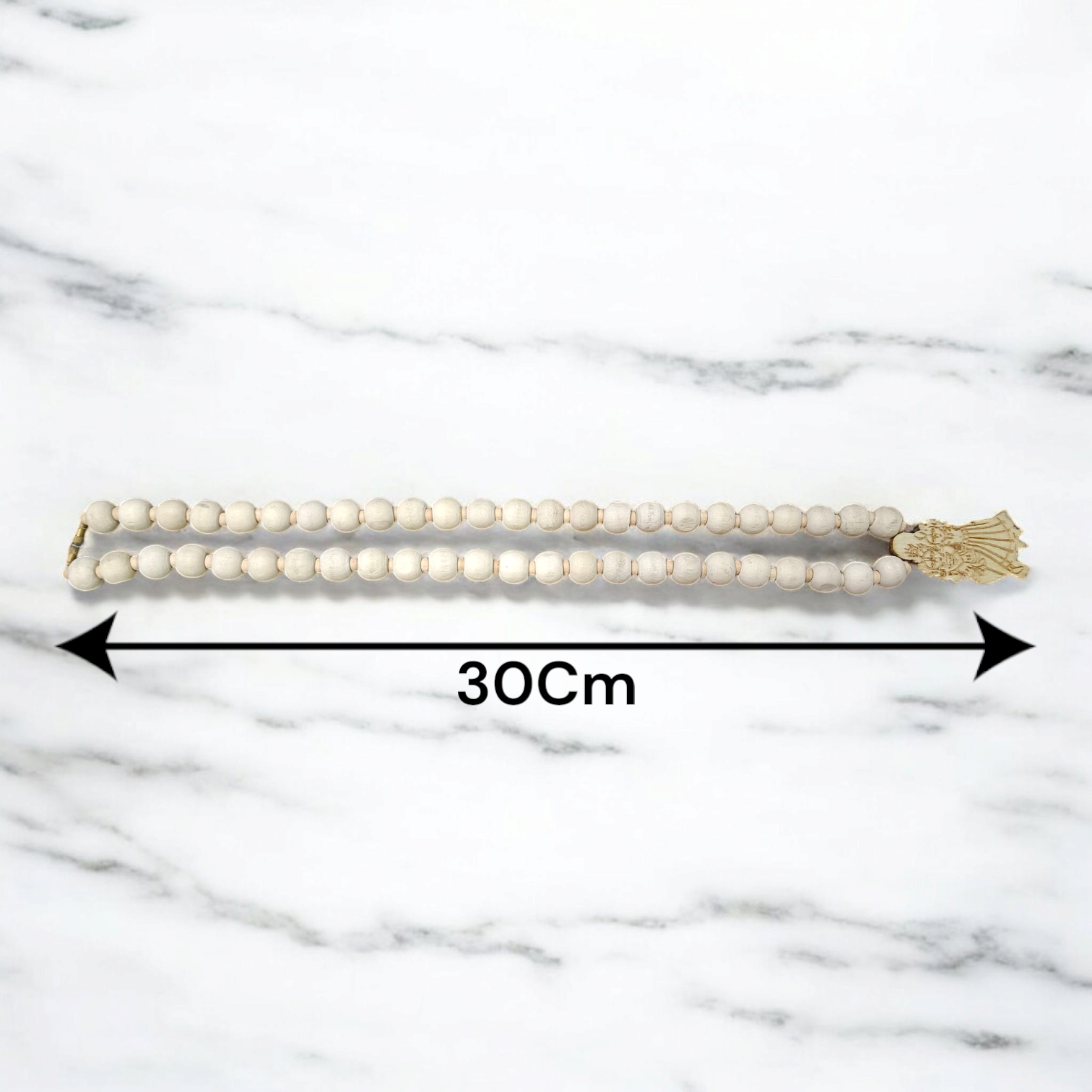 Radha Krishna Tulsi Mala with engraved pendant and screw lock, neatly arranged for devotional use on a soft background