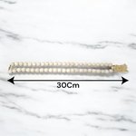 Radha Krishna Tulsi Mala with engraved pendant and screw lock, neatly arranged for devotional use on a soft background