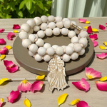 Radha Krishna Tulsi Mala with engraved pendant and screw lock, neatly arranged for devotional use on a soft background