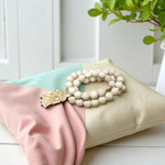 Radha Krishna Tulsi Mala with engraved pendant and screw lock, neatly arranged for devotional use on a soft background