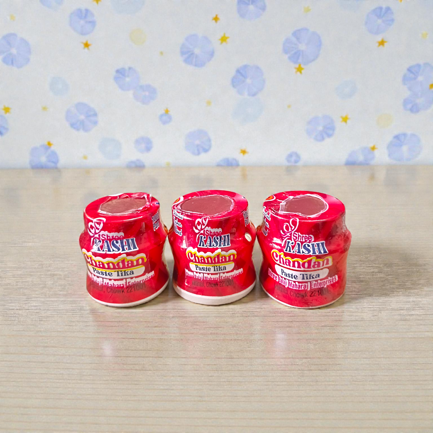 Red chandan paste container used for tilak, puja, and religious ceremonies