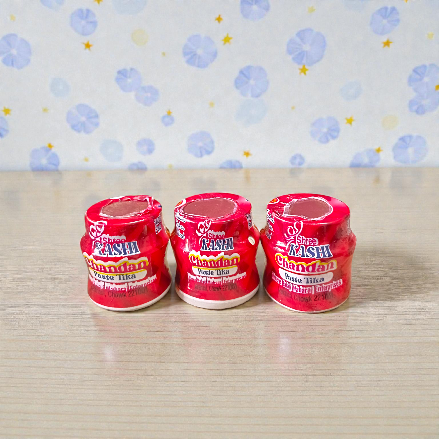 Red chandan paste container used for tilak, puja, and religious ceremonies