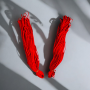 Red cotton Lal Dhaga thread rolls (25 meters each) – Pack of 2, used for spiritual protection rituals