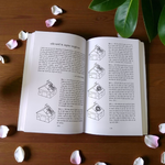 Remedial Vastu-Shastra In Hindi Book by MALAWALA placed on a wooden table with incense and diya, representing harmony and balance at home and office