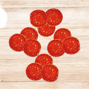 Set of 12 hand-rolled cotton Kalava wicks (Mauli Batti) in red-yellow color, arranged neatly for pooja use