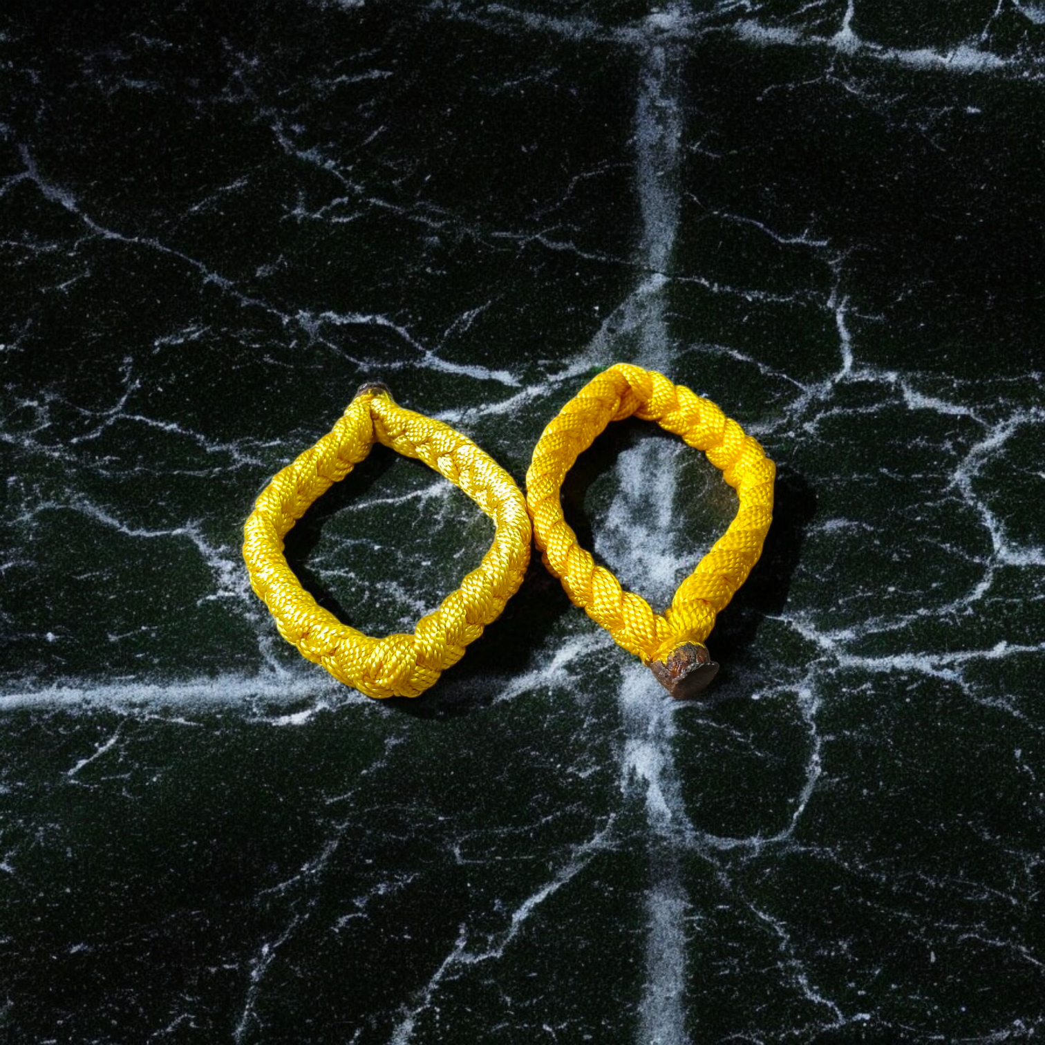 Set of 2 Handmade Yellow Raksha Sutra Bracelets with adjustable cotton thread, designed for spiritual protection and daily wear