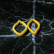 Set of 2 Handmade Yellow Raksha Sutra Bracelets with adjustable cotton thread, designed for spiritual protection and daily wear