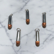 Set of 5 bullet-shaped taweez made of silver and copper with screw caps and free Bhojpatra sheets, designed for spiritual energy and protection
