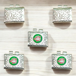 Set of 5 handcrafted silver square taweez with intricate Islamic design and free Bhojpatra sheet placed beside them