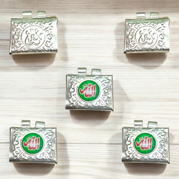Set of 5 handcrafted silver square taweez with intricate Islamic design and free Bhojpatra sheet placed beside them