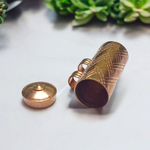 Set of 5 pure copper cylindrical taweez with Bhojpatra prayer sheets arranged on a neutral background