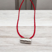 Set of five silver metal taweez amulets with Bhojpatra sheets, displayed against a white background