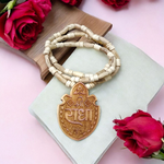 Shri Radha Locket strung in a handcrafted Tulsi Mala with secure screw lock, photographed on a neutral background