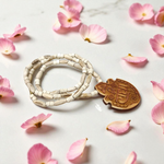 Shri Radha Locket strung in a handcrafted Tulsi Mala with secure screw lock, photographed on a neutral background