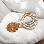 Shri Radha Locket strung in a handcrafted Tulsi Mala with secure screw lock, photographed on a neutral background