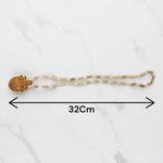 Shri Radha Locket strung in a handcrafted Tulsi Mala with secure screw lock, photographed on a neutral background