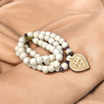 Shri Sita Ram Tulsi Mala with ornate locket and stylish screw lock, displayed elegantly on a neutral surface