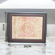 Shri Vastu Dosh Nivaran Yantra inscribed on Bhojpatra and framed in a premium wooden frame with a golden finish, placed on a decorative background