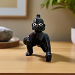 Small Black Laddu Gopal idol in sitting posture with intricate detailing, ideal for home temple and pooja