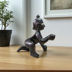 Small Black Laddu Gopal idol in sitting posture with intricate detailing, ideal for home temple and pooja