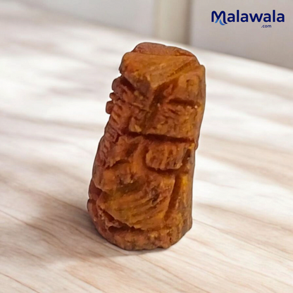 Small Haldi Ganesh Ji idol handcrafted from turmeric – perfect for home temple, office desk, and car dashboard – vibrant and auspicious