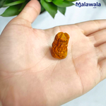 Small Haldi Ganesh Ji idol handcrafted from turmeric – perfect for home temple, office desk, and car dashboard – vibrant and auspicious