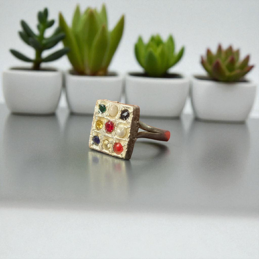 Square-shaped Navratan Ring by MALAWALA with 9 colorful gemstones set in Panchdhatu, suitable for astrology enthusiasts and spiritual use