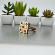 Square-shaped Navratan Ring by MALAWALA with 9 colorful gemstones set in Panchdhatu, suitable for astrology enthusiasts and spiritual use