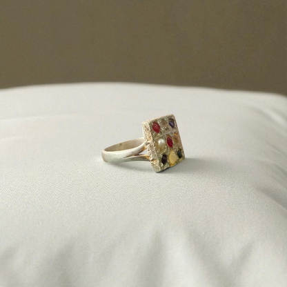 Square-shaped Navratan Ring by MALAWALA with 9 colorful gemstones set in Panchdhatu, suitable for astrology enthusiasts and spiritual use