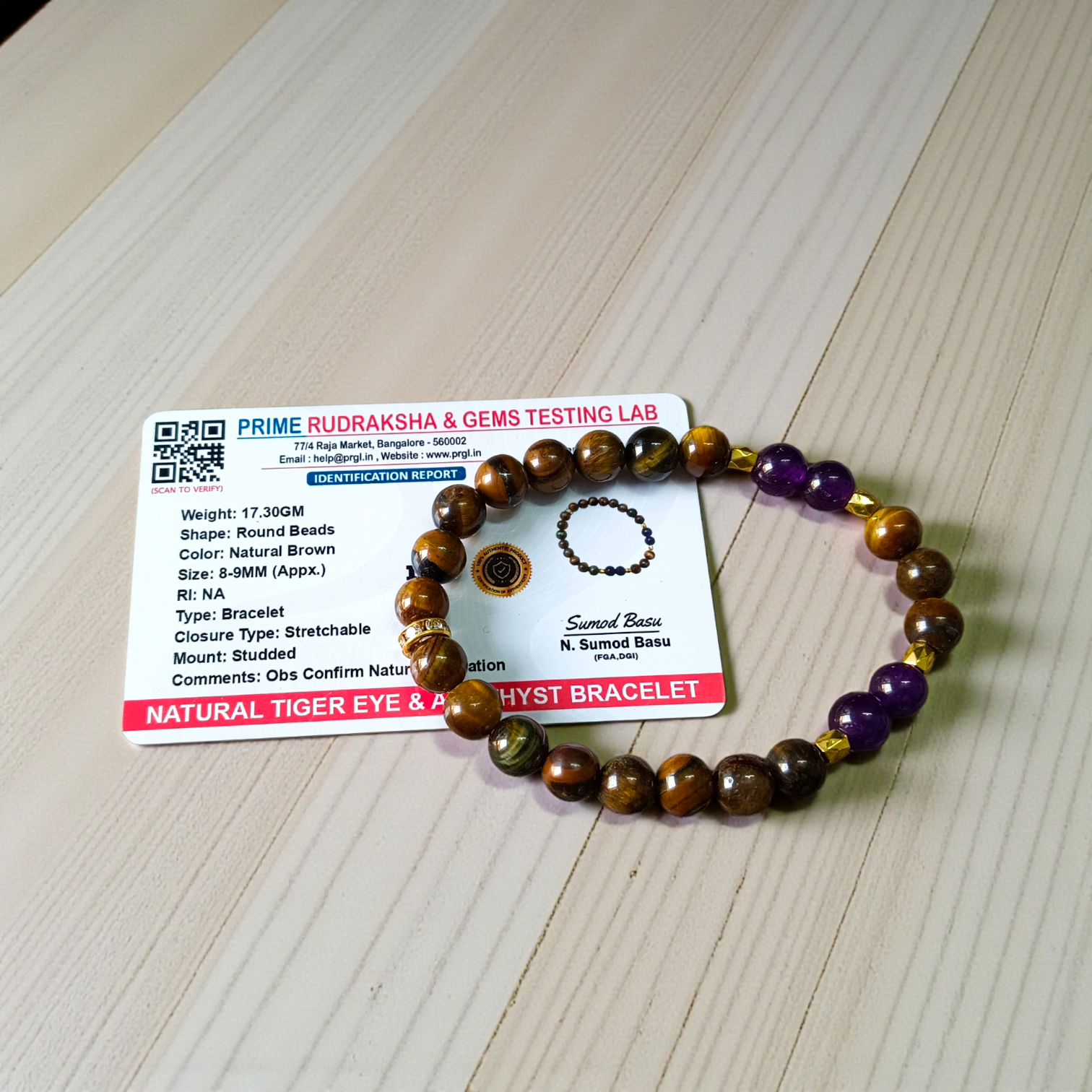 Stretchable bracelet made with lab certified 8mm Tiger Eye and Amethyst gemstone beads, ideal for meditation and daily wear